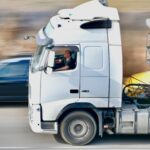Dynamic shot of a white truck speeding on a highway in Agramunt, Spain.